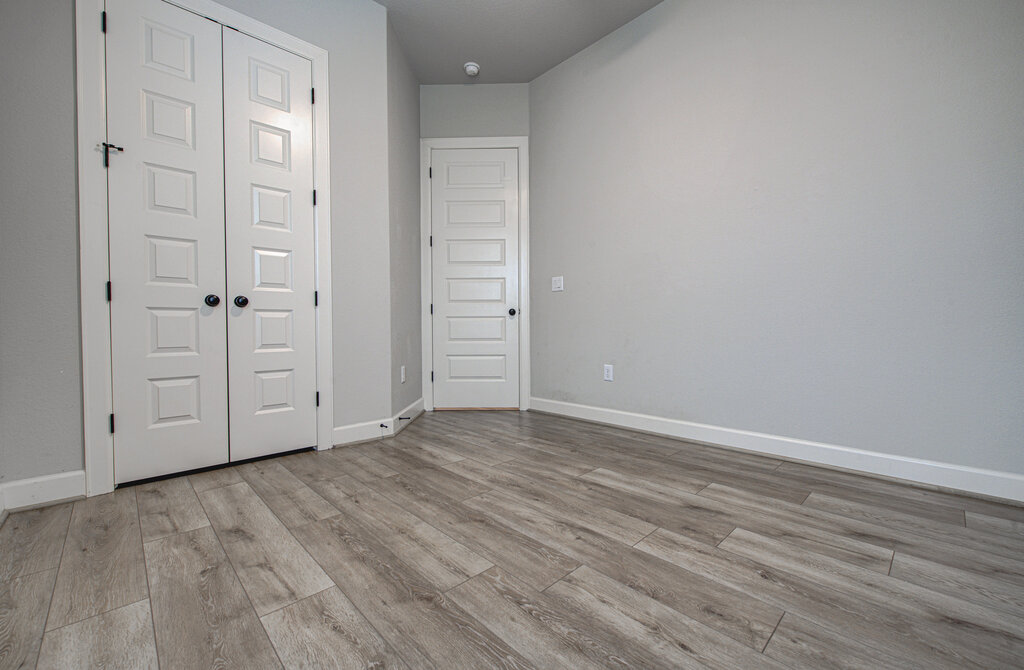 2903 Sebring Circle Austin, TX 78747 - Photo 8 of 31 a view of an empty room with wooden floor