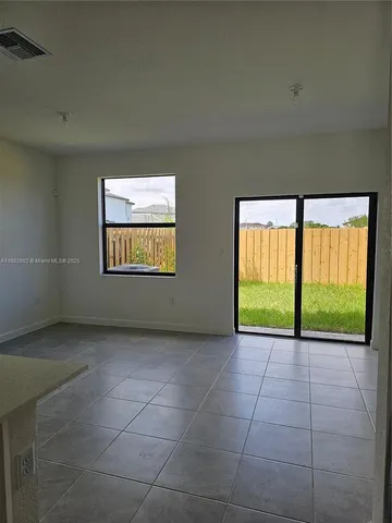 a view of a room with a large window