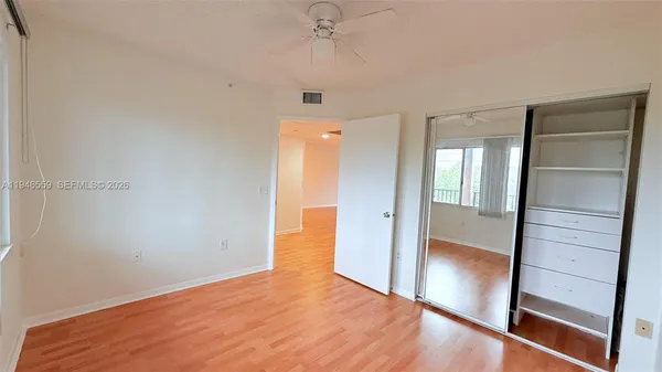 a view of a balcony with yard