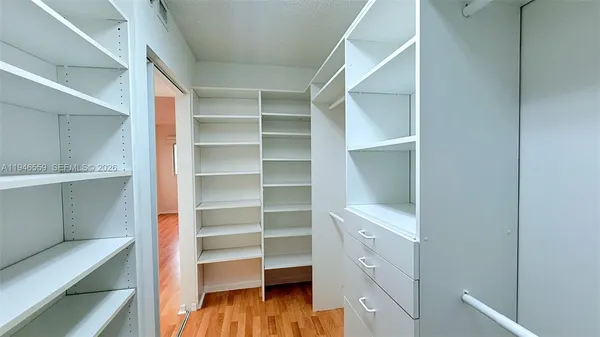 a view of a swimming pool with outdoor seating