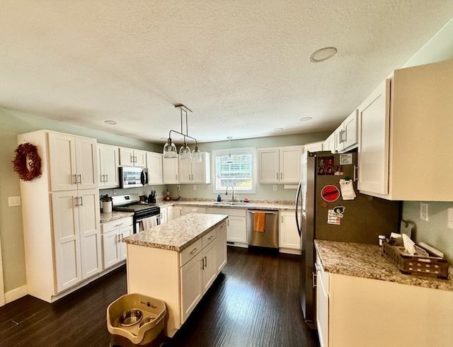 708 East North Street Monticello, IL 61856 - Photo 11 of 38 a kitchen with a sink stove and wooden floor