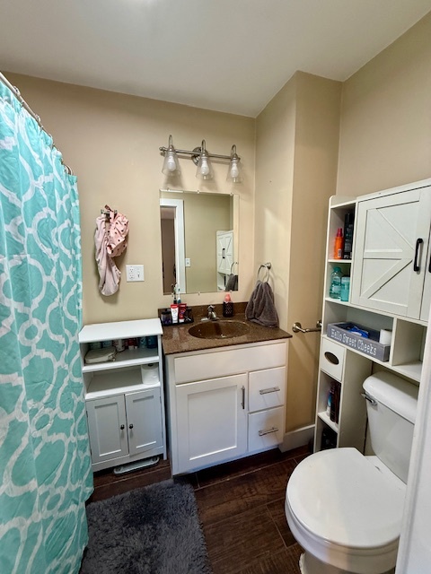 708 East North Street Monticello, IL 61856 - Photo 16 of 38 a bathroom with a toilet sink and mirror