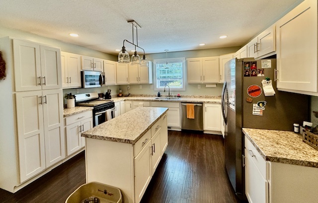 708 East North Street Monticello, IL 61856 - Photo 10 of 38 a kitchen with stainless steel appliances granite countertop a sink stove and refrigerator