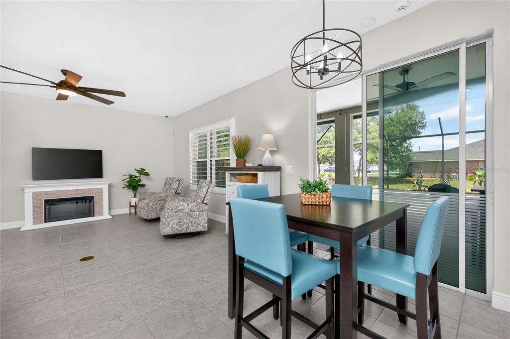 27366 Deep Creek Boulevard Punta Gorda, FL 33983 - Photo 17 of 63 a view of a dining room with furniture window and wooden floor