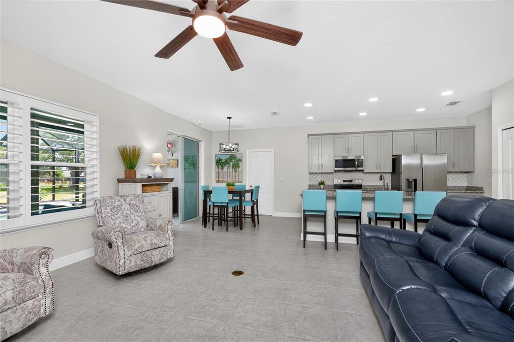 27366 Deep Creek Boulevard Punta Gorda, FL 33983 - Photo 20 of 63 a living room with furniture and kitchen view