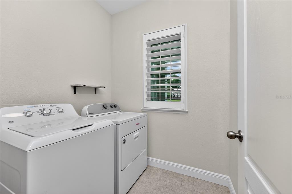 27366 Deep Creek Boulevard Punta Gorda, FL 33983 - Photo 22 of 63 a utility room with dryer and washer