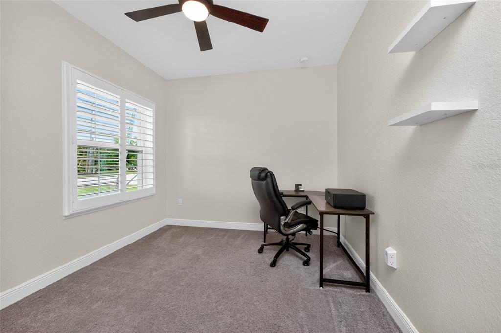 27366 Deep Creek Boulevard Punta Gorda, FL 33983 - Photo 23 of 63 a workspace with furniture and a window