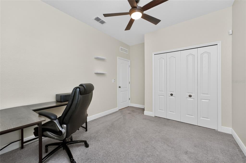 27366 Deep Creek Boulevard Punta Gorda, FL 33983 - Photo 24 of 63 a view of a workspace with furniture and a window