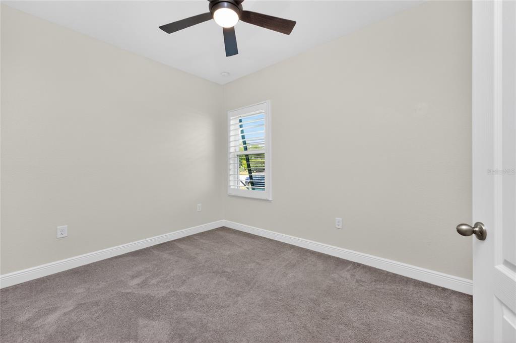 27366 Deep Creek Boulevard Punta Gorda, FL 33983 - Photo 28 of 63 an empty room with a window and a fan