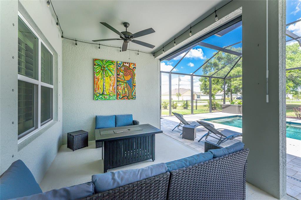 27366 Deep Creek Boulevard Punta Gorda, FL 33983 - Photo 40 of 63 a living room with furniture and a large window