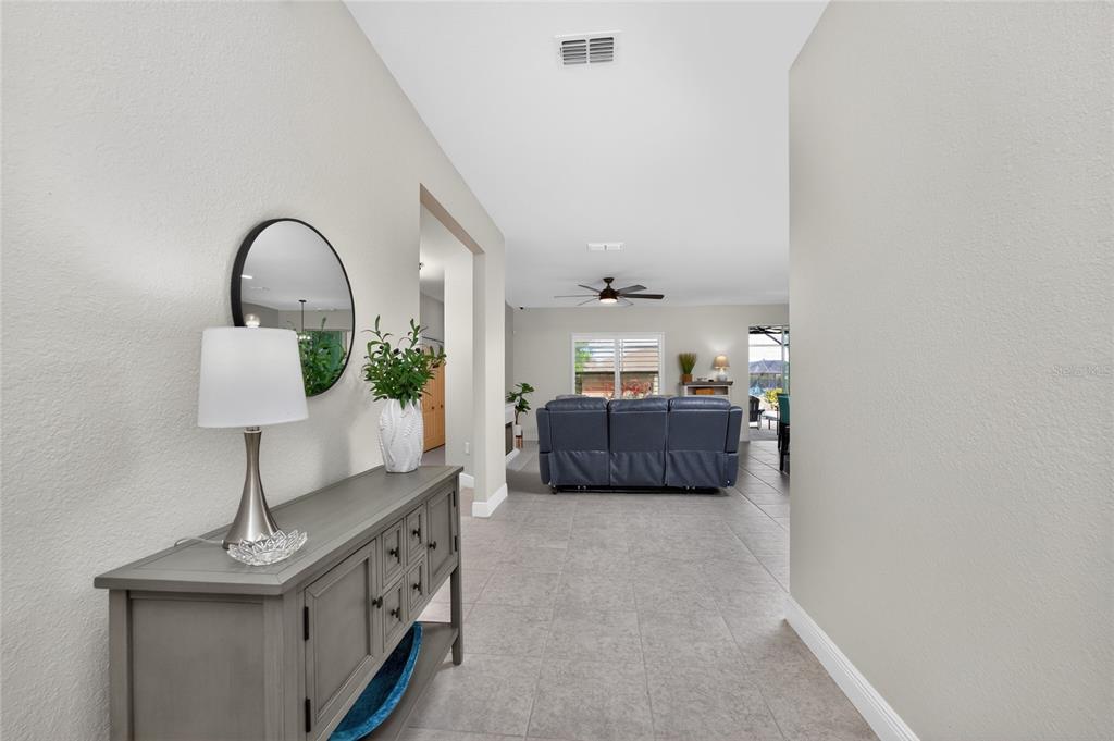 27366 Deep Creek Boulevard Punta Gorda, FL 33983 - Photo 4 of 63 a living room with furniture and a window