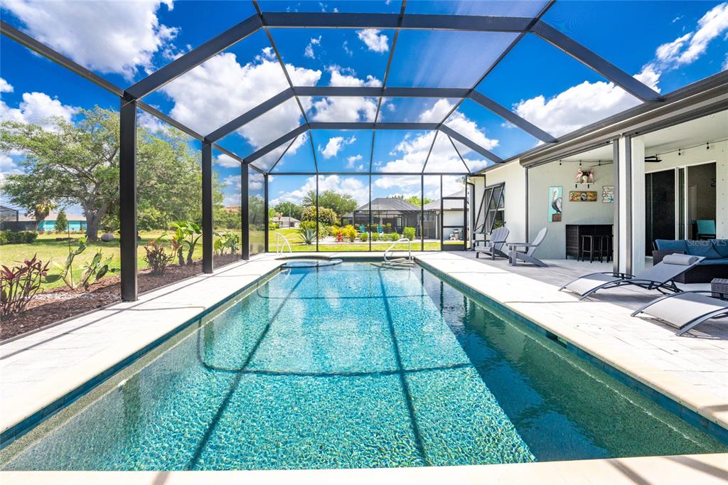 27366 Deep Creek Boulevard Punta Gorda, FL 33983 - Photo 46 of 63 a swimming pool with large garden view