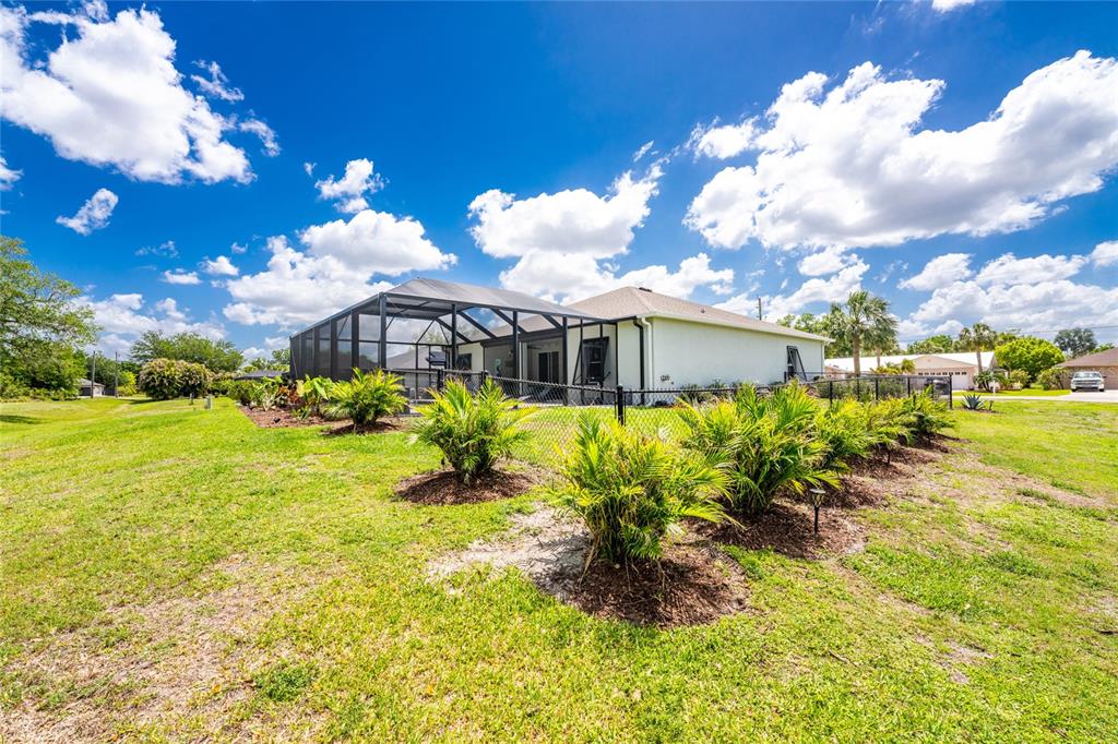 27366 Deep Creek Boulevard Punta Gorda, FL 33983 - Photo 52 of 63 a view of a house with a yard