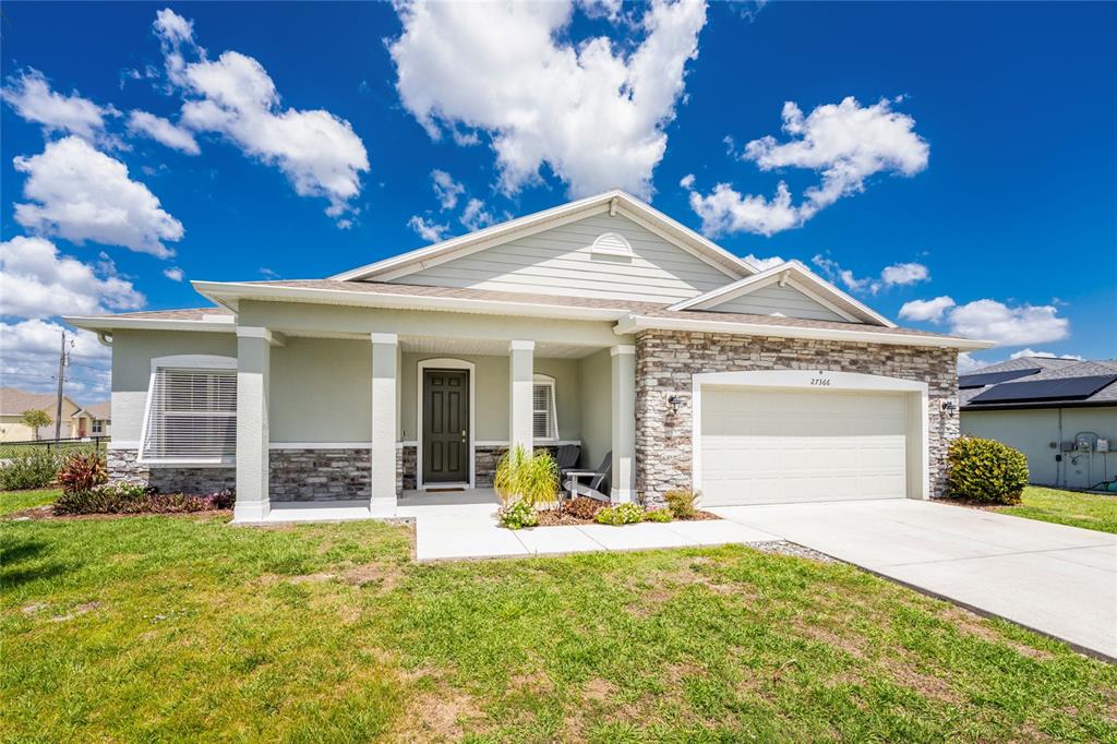 27366 Deep Creek Boulevard Punta Gorda, FL 33983 - Photo 60 of 63 a view of a house with a fountain in a yard