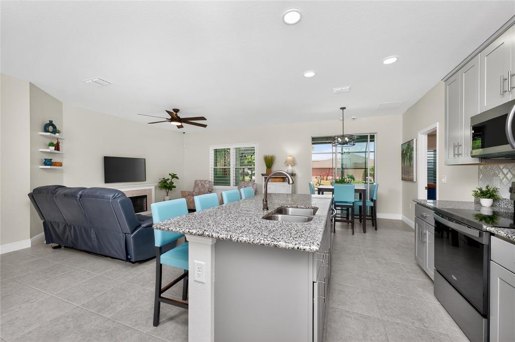 27366 Deep Creek Boulevard Punta Gorda, FL 33983 - Photo 10 of 63 a living room with furniture and a flat screen tv