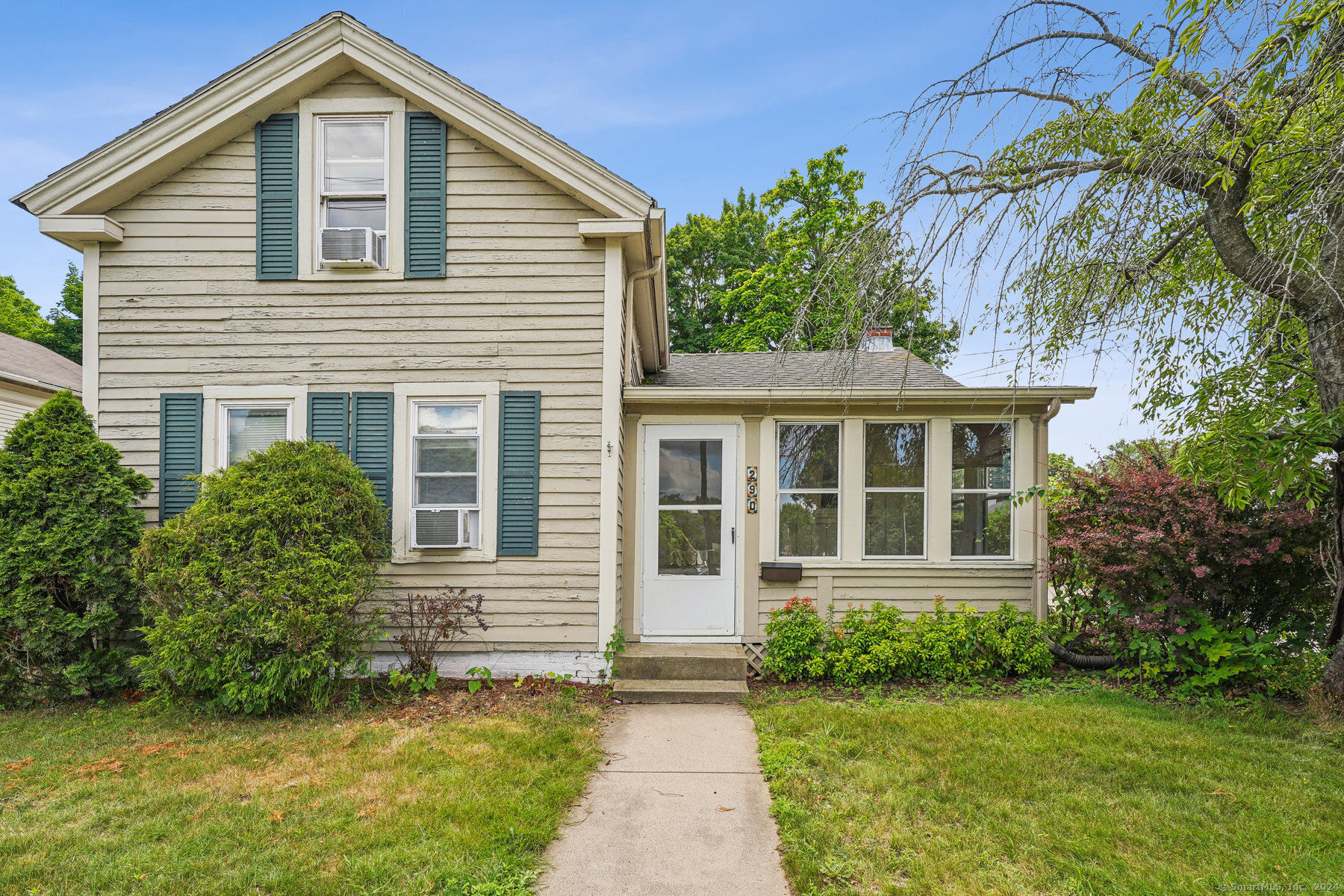 290 Hazard Avenue Enfield, CT 06082 - Photo 1 of 1 a front view of a house with a garden