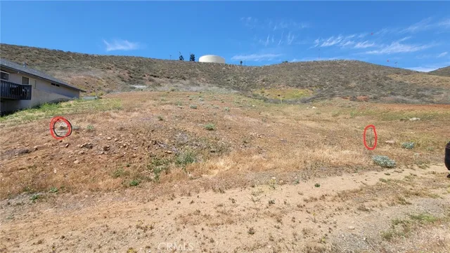 a view of a dry space with mountain