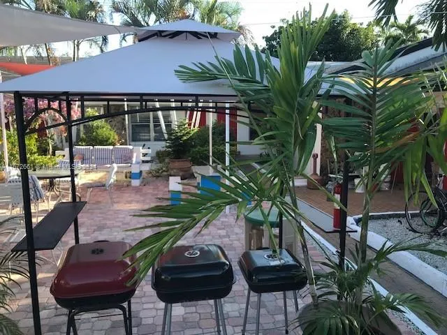 a view of a chairs and table in a patio