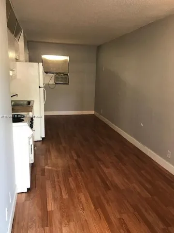 a view of a storage & utility room with wooden floor