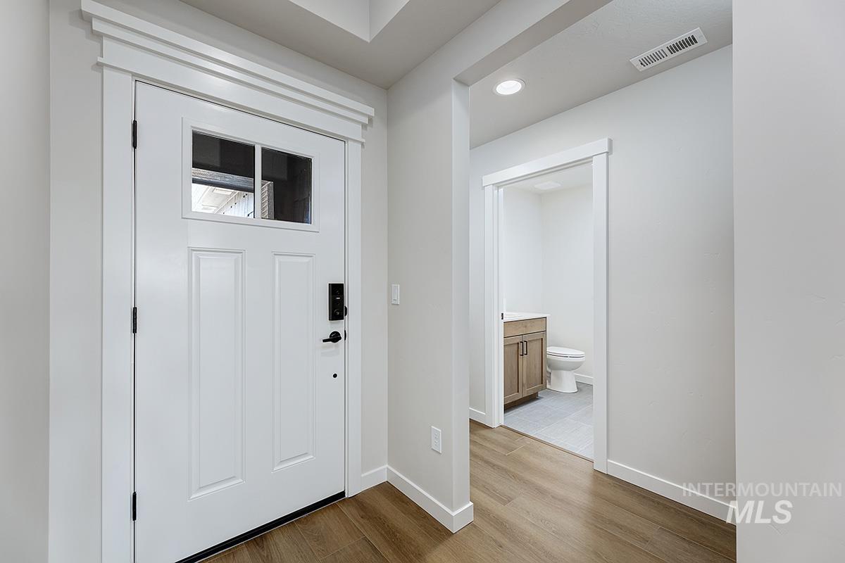 1700 East Hadler Street Meridian, ID 83642 - Photo 2 of 25 Foyer entrance with light wood-type flooring and recessed lighting
