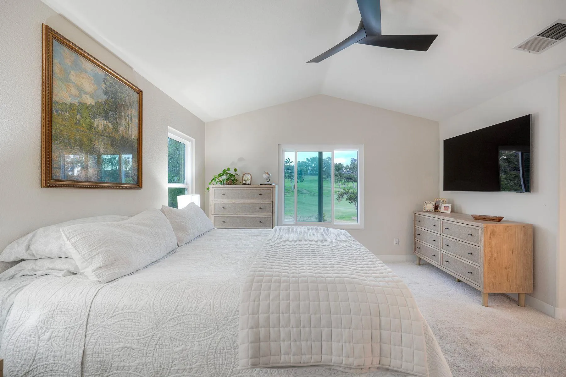 529 Peach Tree Way San Marcos, CA 92069 - Photo 21 of 30 a bedroom with a bed and a flat screen tv