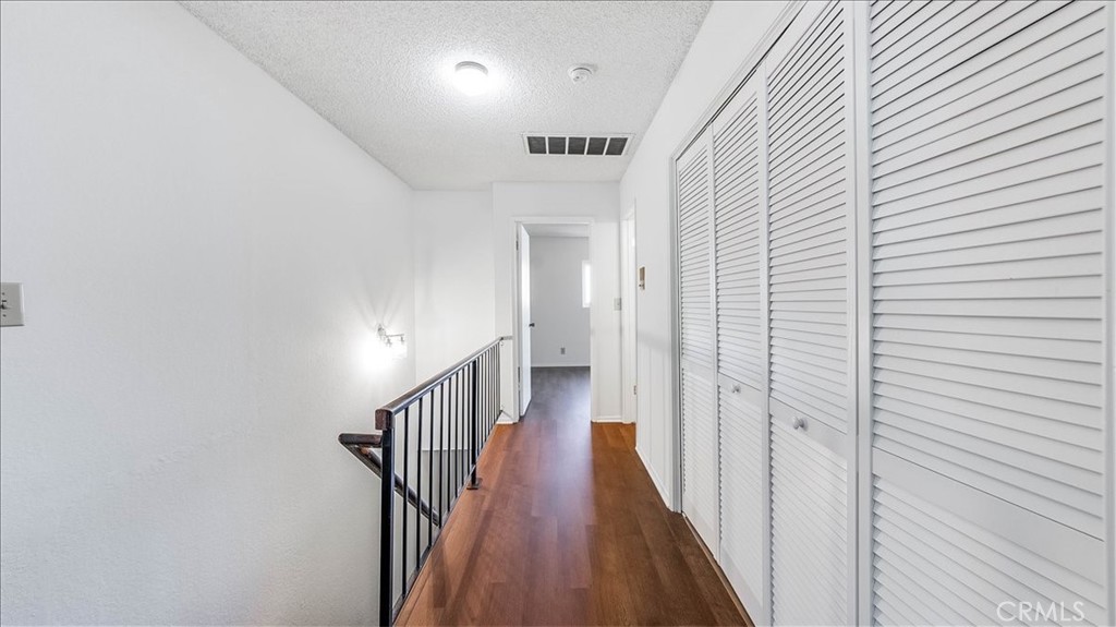 636 East Harvard Road, Unit C Burbank, CA 91501 - Photo 6 of 13 a view of a hallway with wooden floor
