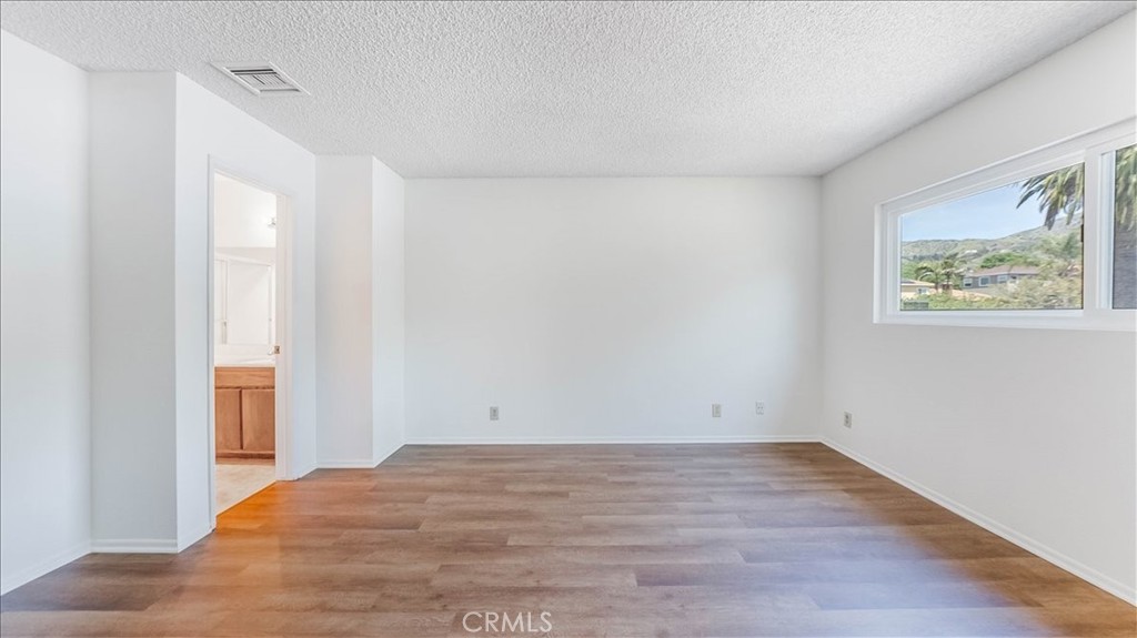 636 East Harvard Road, Unit C Burbank, CA 91501 - Photo 8 of 13 a view of room with window and hardwood floor