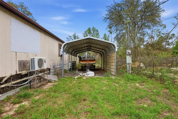 a view of a house with wooden fence