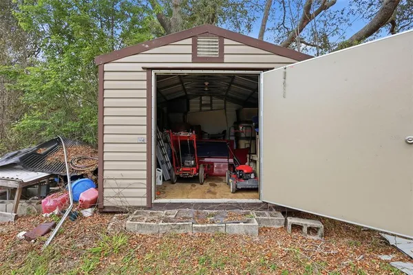 a kitchen with a refrigerator and a stove top oven