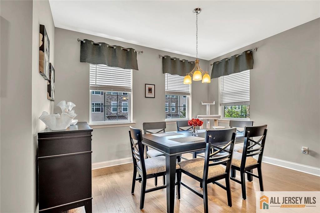 1501 Hights Farm Road South, Unit 1501 Monroe Township, NJ 08831 - Photo 12 of 30 a dining room with furniture and window