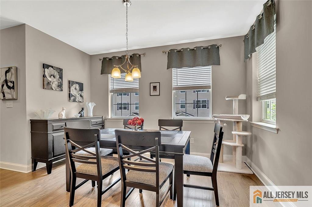 1501 Hights Farm Road South, Unit 1501 Monroe Township, NJ 08831 - Photo 13 of 30 a view of a dining room with furniture and window