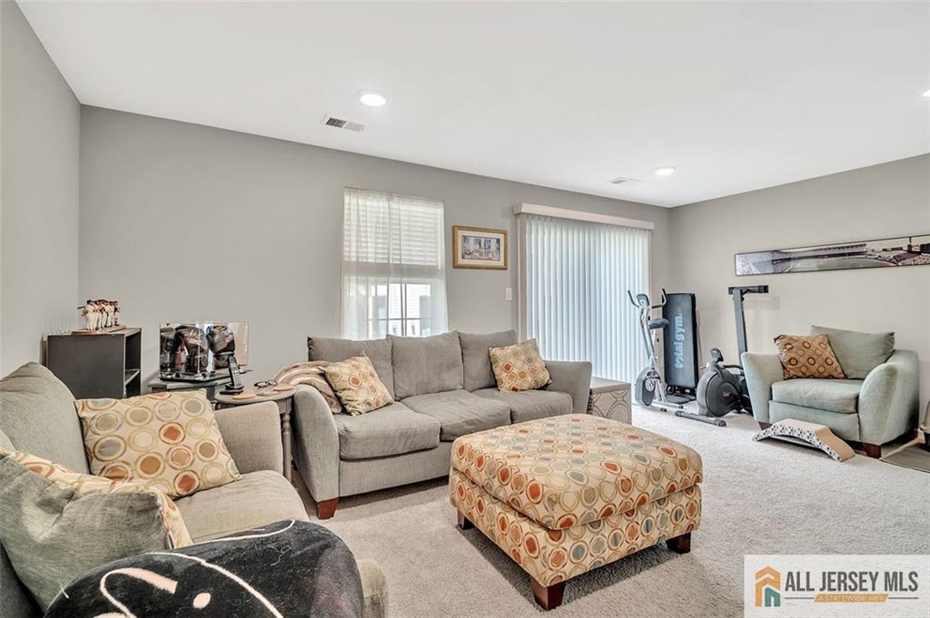 1501 Hights Farm Road South, Unit 1501 Monroe Township, NJ 08831 - Photo 19 of 30 a living room with furniture and a couch