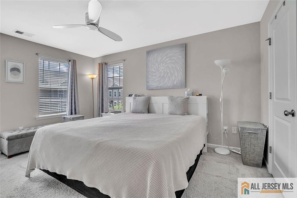 1501 Hights Farm Road South, Unit 1501 Monroe Township, NJ 08831 - Photo 25 of 30 a spacious bedroom with a bed and a window