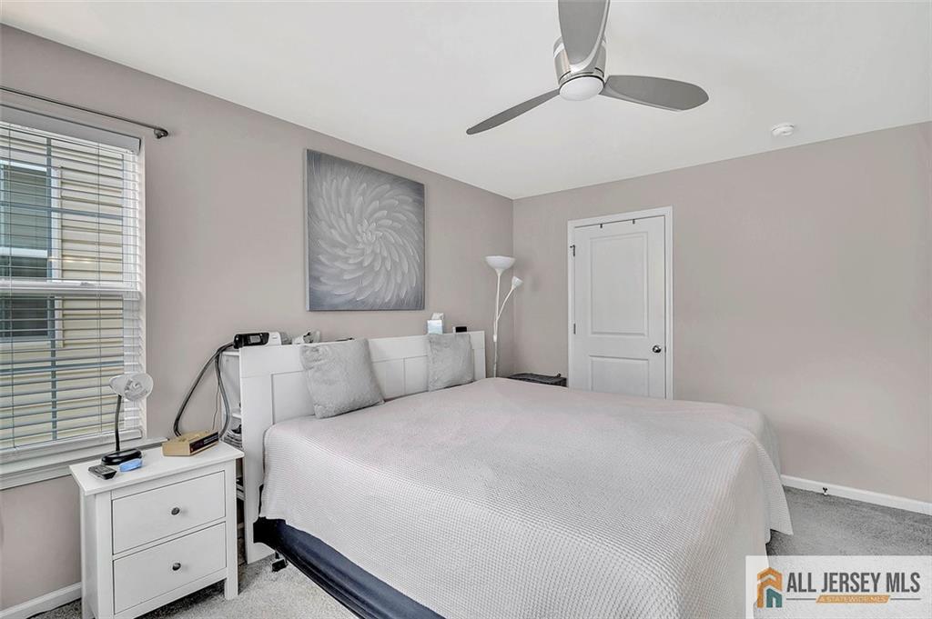 1501 Hights Farm Road South, Unit 1501 Monroe Township, NJ 08831 - Photo 26 of 30 a bedroom with a bed and a window