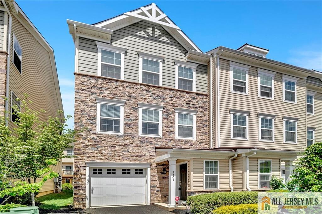 1501 Hights Farm Road South, Unit 1501 Monroe Township, NJ 08831 - Photo 3 of 30 a front view of a house with a yard