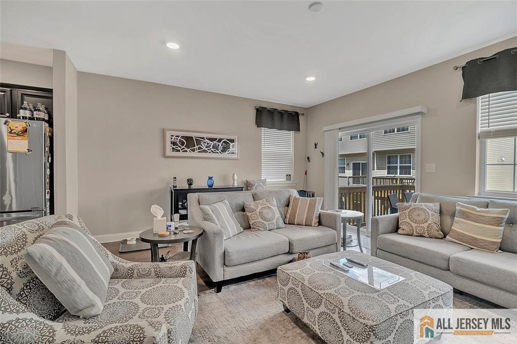 1501 Hights Farm Road South, Unit 1501 Monroe Township, NJ 08831 - Photo 8 of 30 a living room with furniture and a couch
