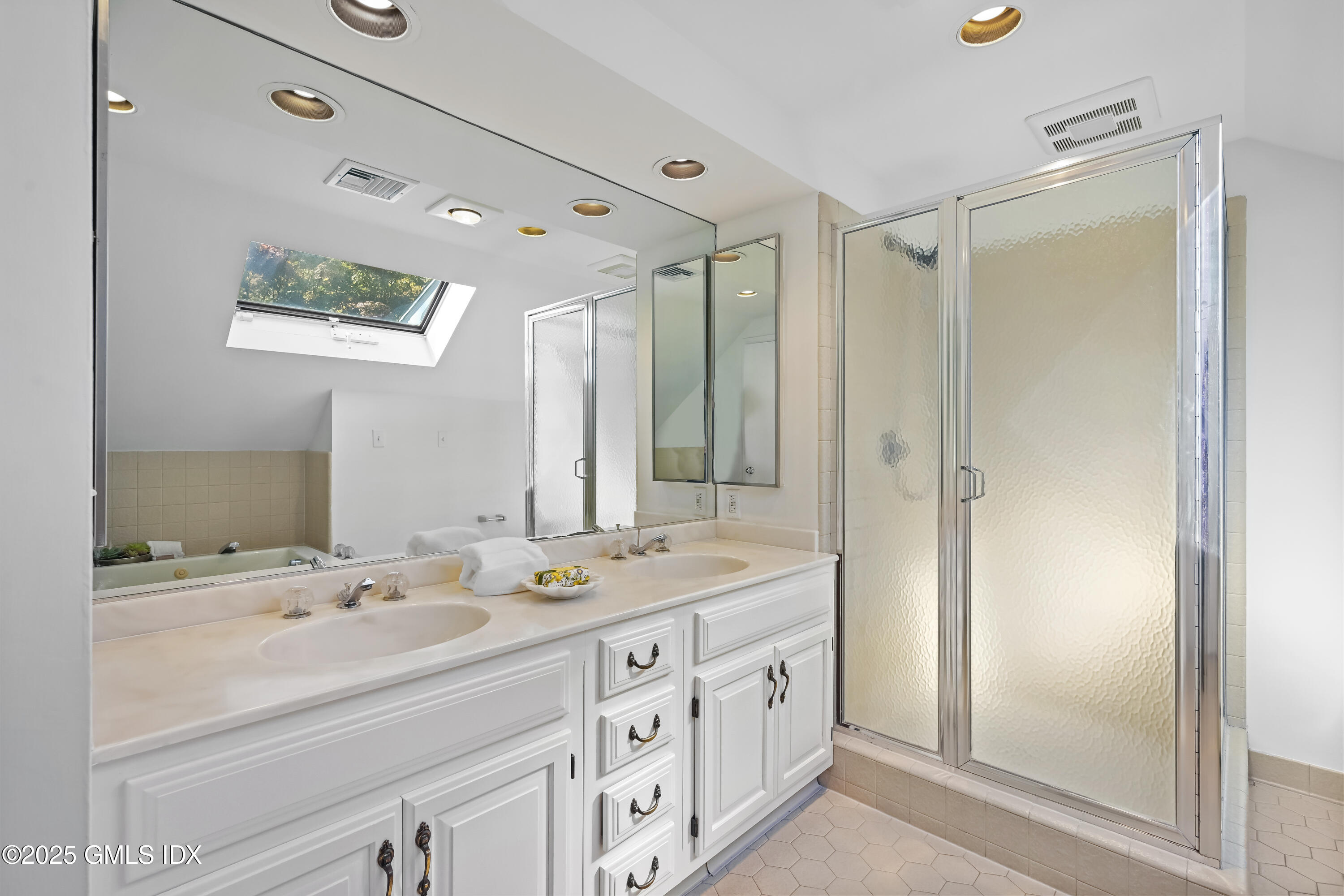 38 Bedford Road Greenwich, CT 06831 - Photo 17 of 32 a bathroom with a double vanity sink mirror and double