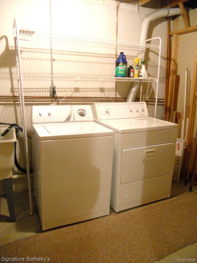 22262 Pondview, Unit 19 Novi, MI 48375 - Photo 22 of 29 Nice laundry area. Washing and Dryer stay.