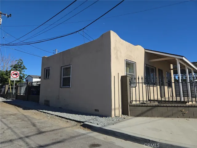 a white toilet sitting next to a white sink
