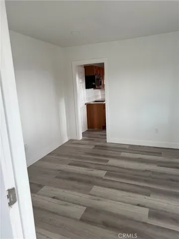 a view of parking space in front of a building