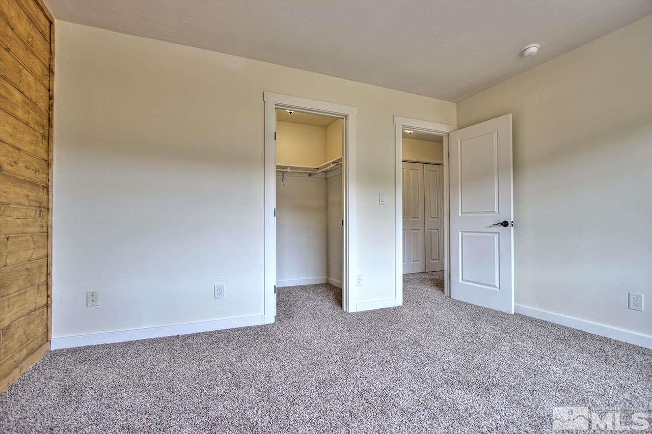 2240 Lousetown Road Reno, NV 89521 - Photo 17 of 25 an empty room with closet and windows