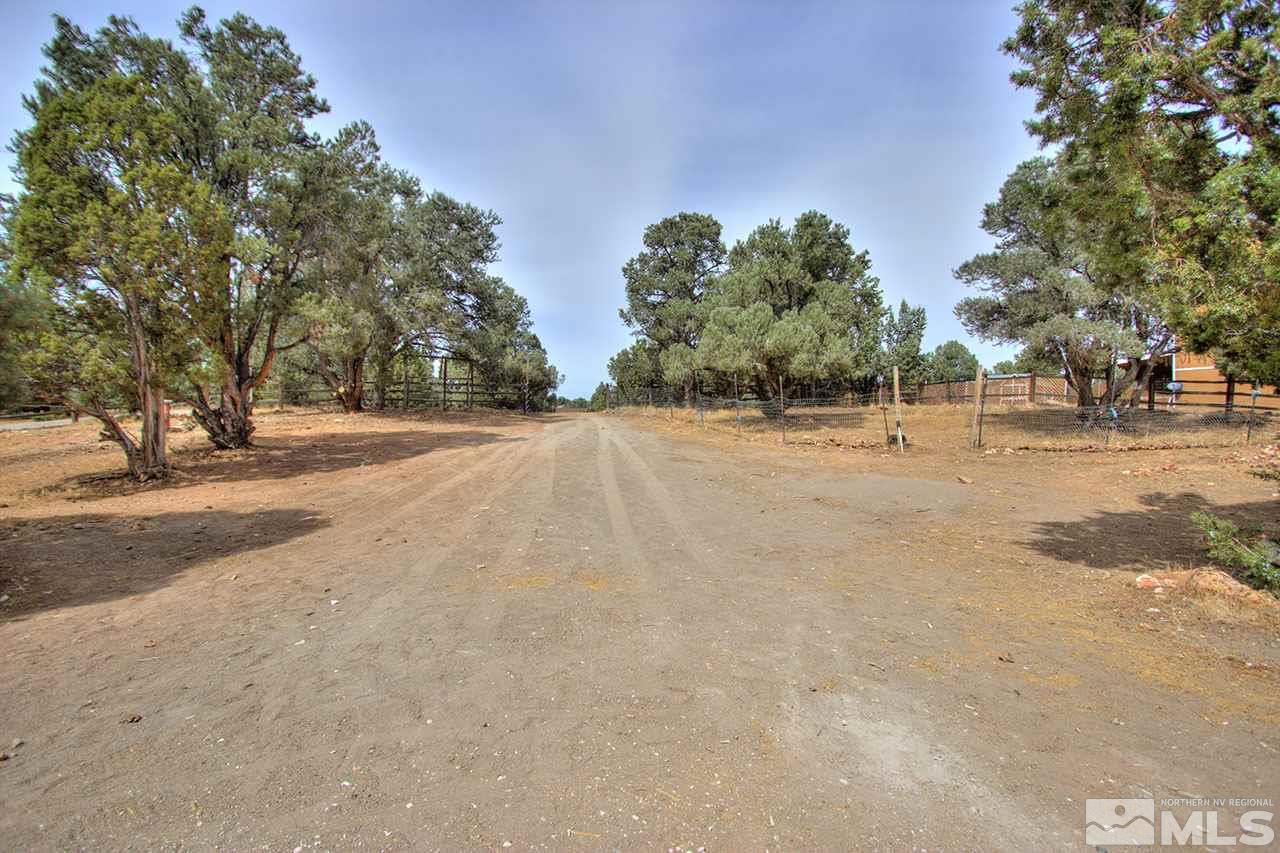2240 Lousetown Road Reno, NV 89521 - Photo 24 of 25 a backyard of a house with trees and trees