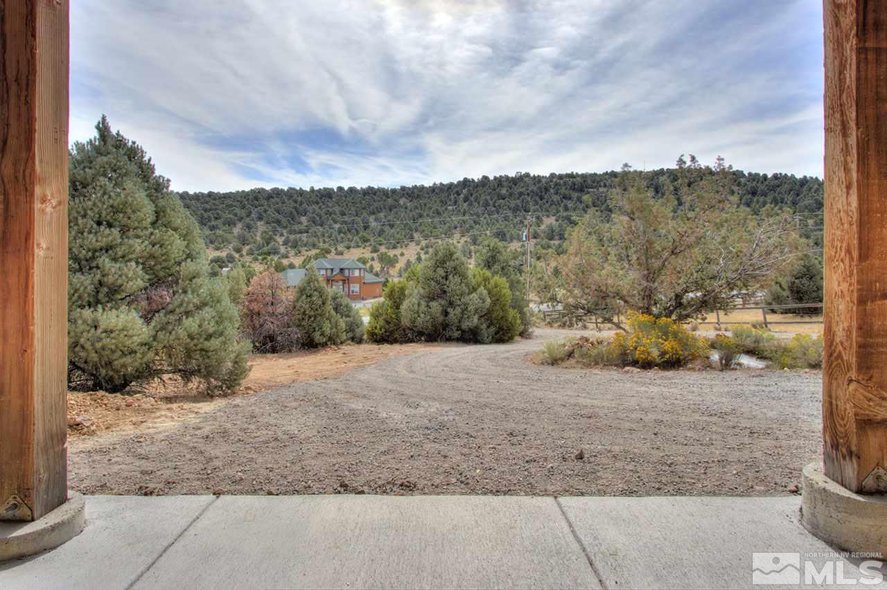 2240 Lousetown Road Reno, NV 89521 - Photo 3 of 25 a view of a dry yard with wooden fence