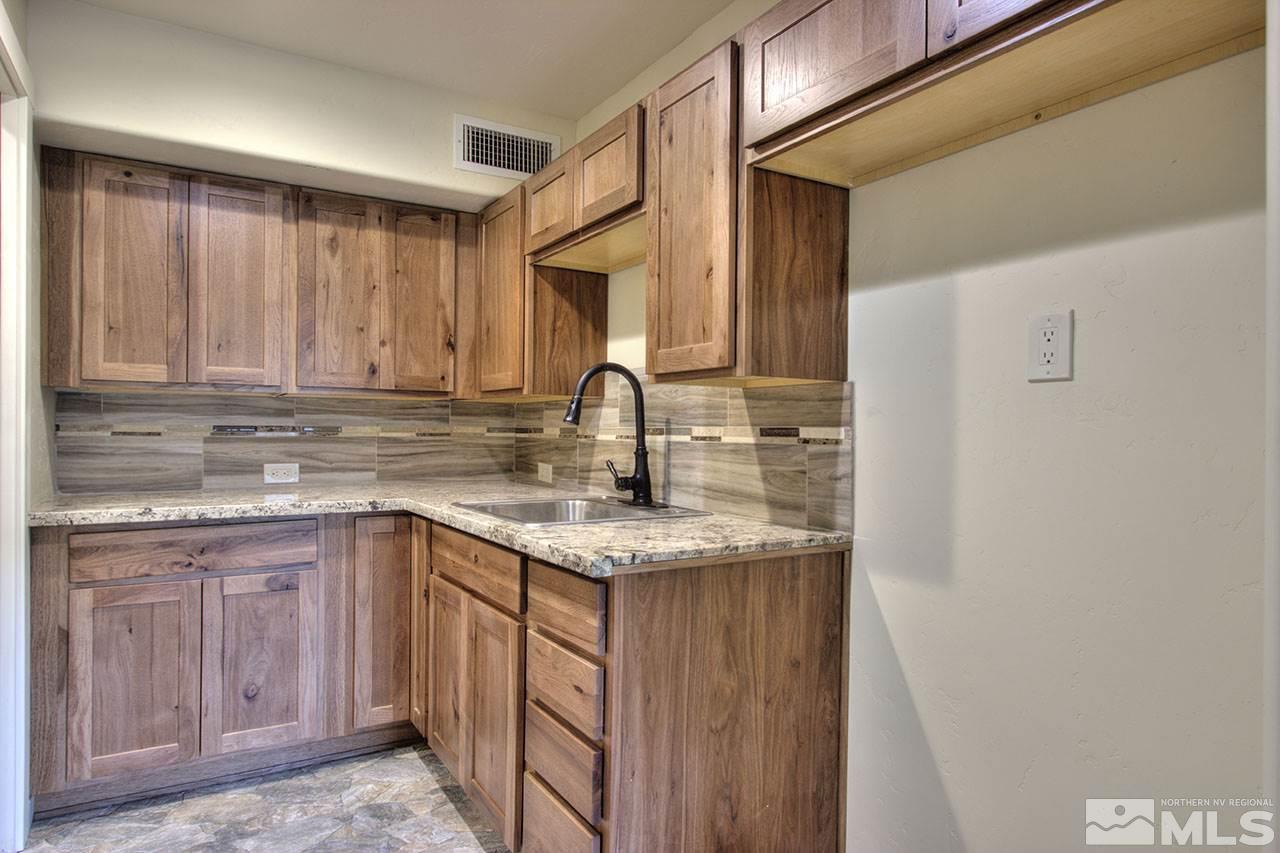 2240 Lousetown Road Reno, NV 89521 - Photo 7 of 25 a kitchen with a sink and cabinets