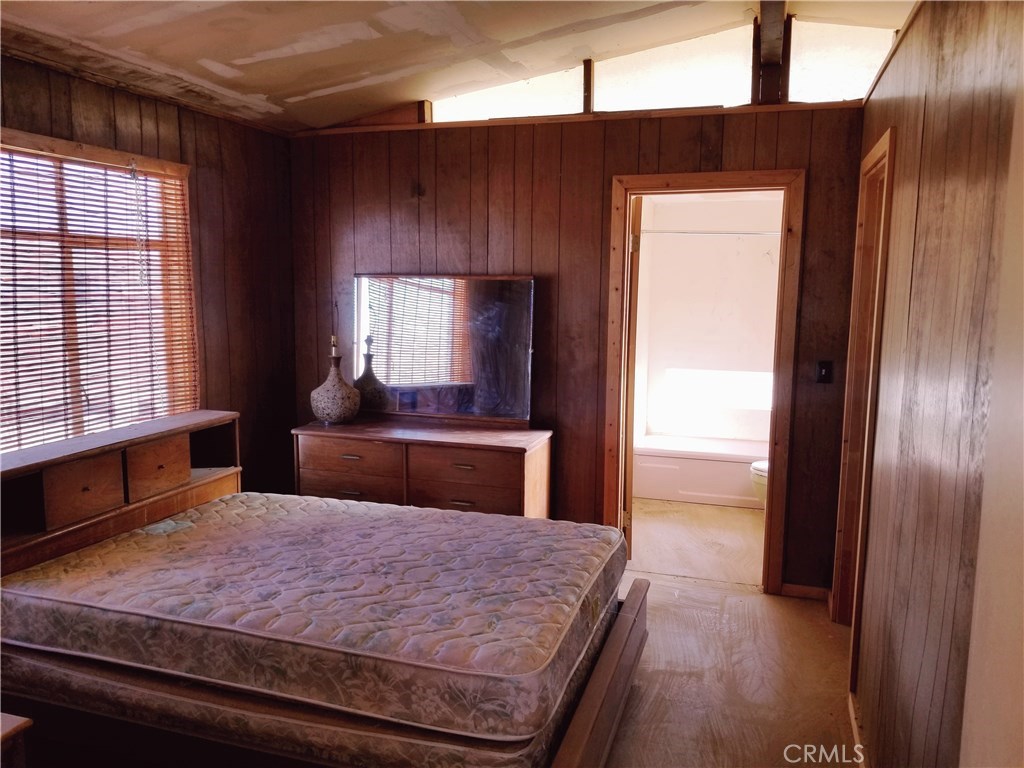 80649 Brown Road Twentynine Palms, CA 92277 - Photo 9 of 15 a bedroom with a large bed and a dresser