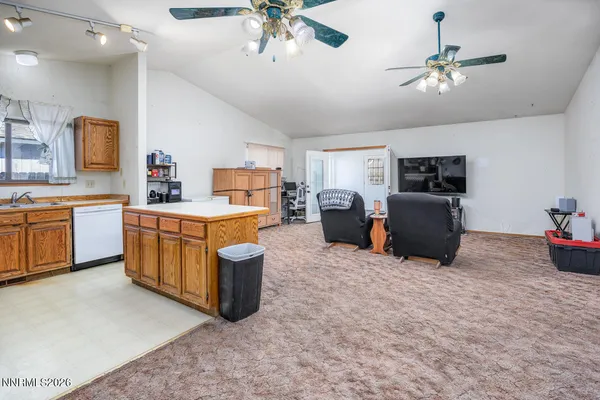a kitchen with a cabinets and stainless steel appliances