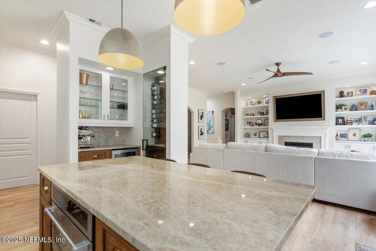 1047 Eagle Point Drive St. Augustine, FL 32092 - Photo 15 of 85 a kitchen with stainless steel appliances a stove a sink a microwave and a refrigerator