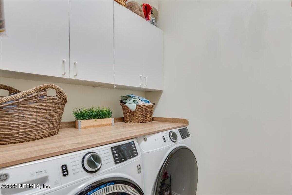 1047 Eagle Point Drive St. Augustine, FL 32092 - Photo 24 of 85 a utility room with dryer and washer