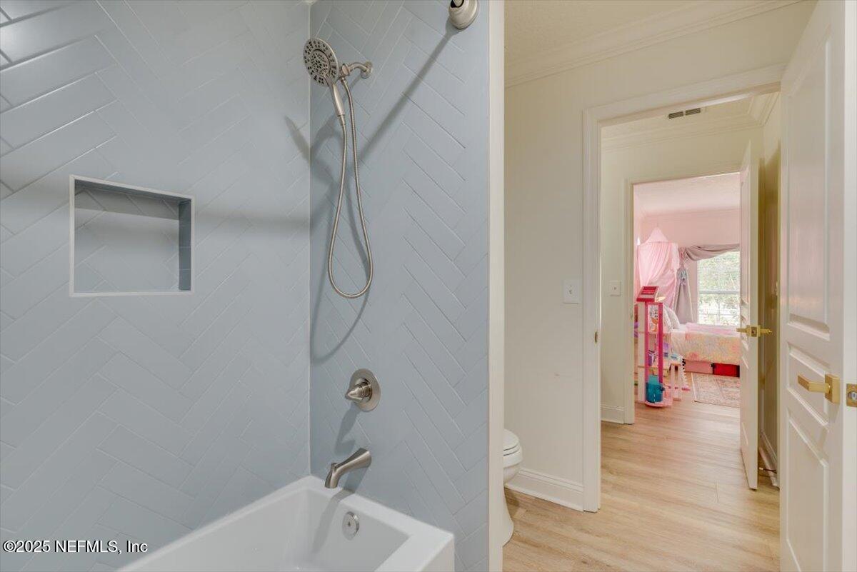 1047 Eagle Point Drive St. Augustine, FL 32092 - Photo 40 of 85 a bathroom with a bathtub and a shower