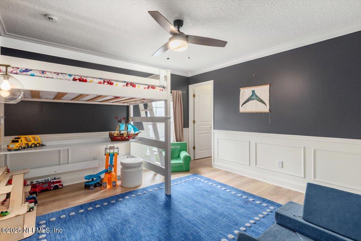 1047 Eagle Point Drive St. Augustine, FL 32092 - Photo 42 of 85 a living room with furniture and wooden floor